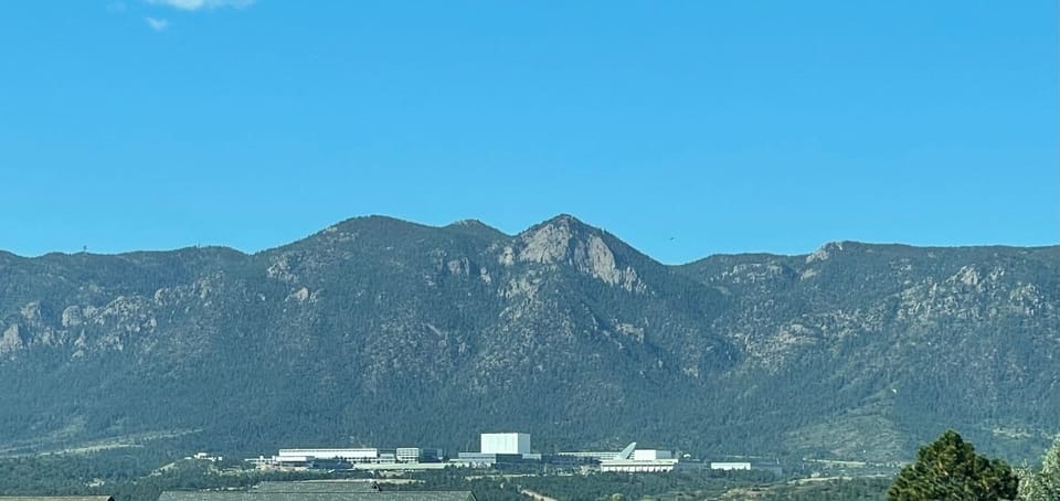 USAFA is beautifully lit up @ night and easily visible and Pikes Peak is too
