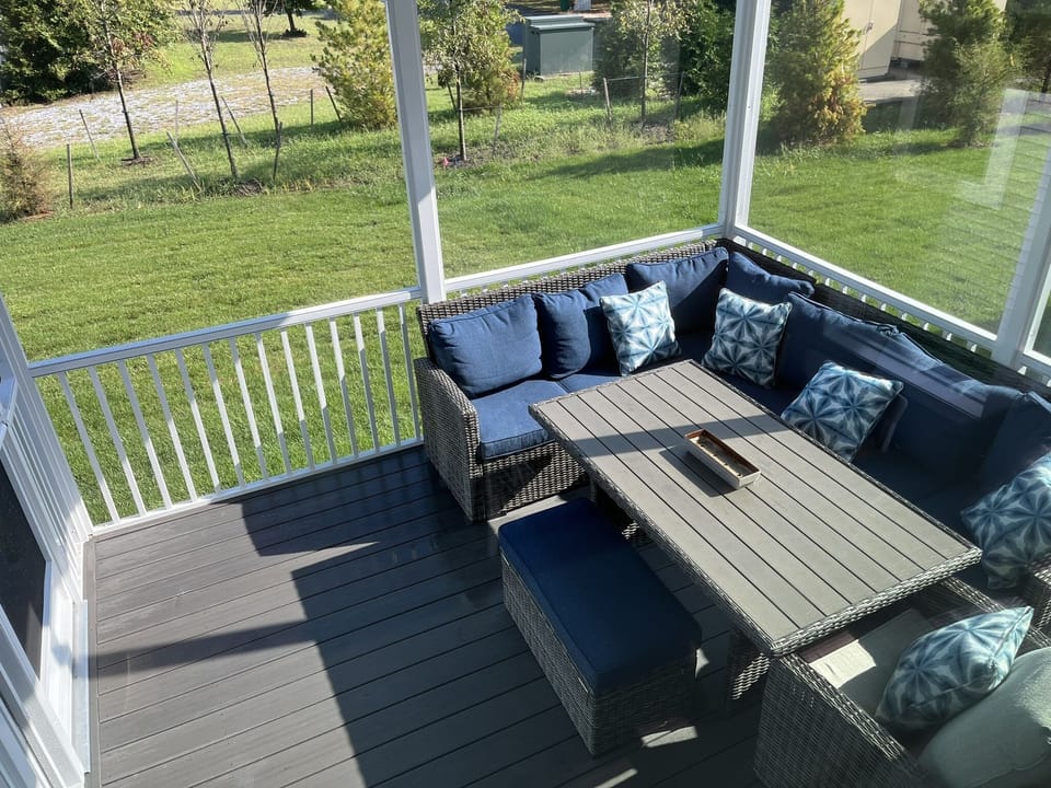 Outdoor dining in screened in porch