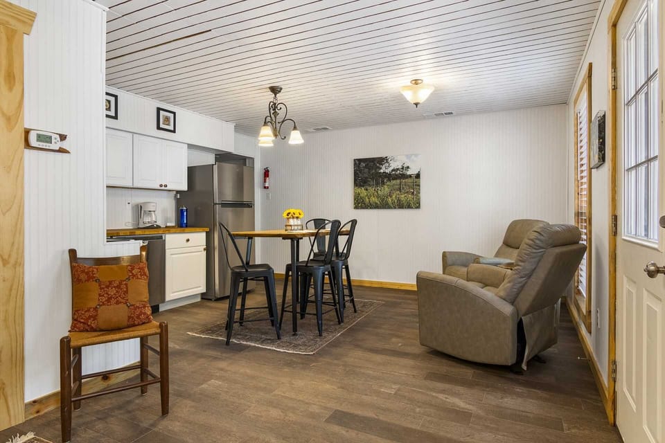 Windows are placed all around the cabin, allowing warm natural light and pretty Hill Country views inside.