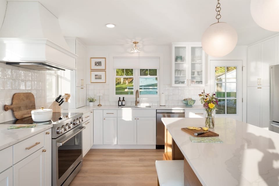 The dishwasher will help keep the dishes at bay, but don't forget to grab a seat to chat with friends. 