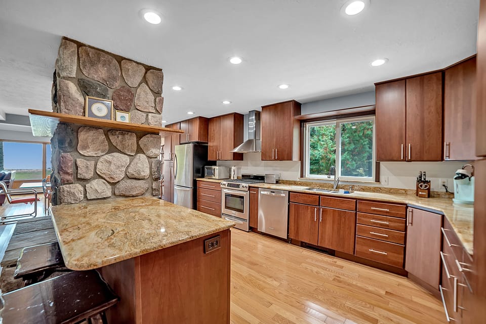 Huge kitchen with a gas range and tons of counter space