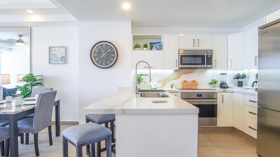 The kitchen counter and a comfortable spot for making meals.