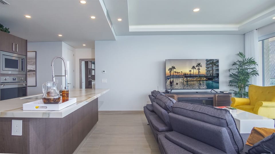 Roomy living area is open, with a large counter available at the kitchen island.