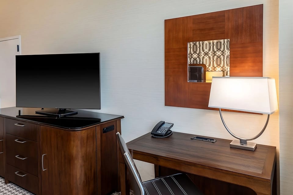 Settle in comfortably with a dedicated desk and flat-screen TV.