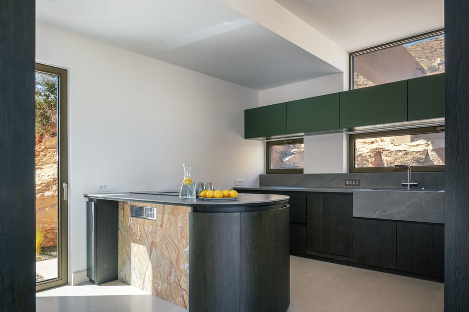 Fully-equipped kitchen with high-end appliances and an island counter for culinary adventures.
