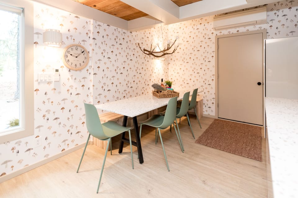 The dining table is also a custom built piece meant to coordinate with the kitchen island and seats 8 comfortably!