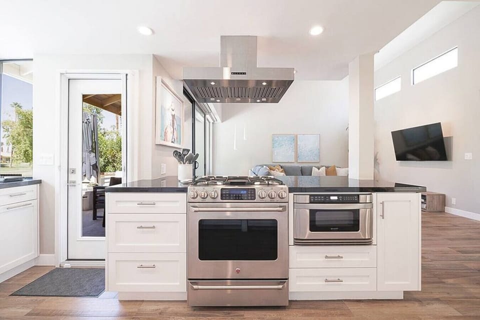 The fully stocked kitchen is a chef`s delight, boasting top-of-the-line appliances
