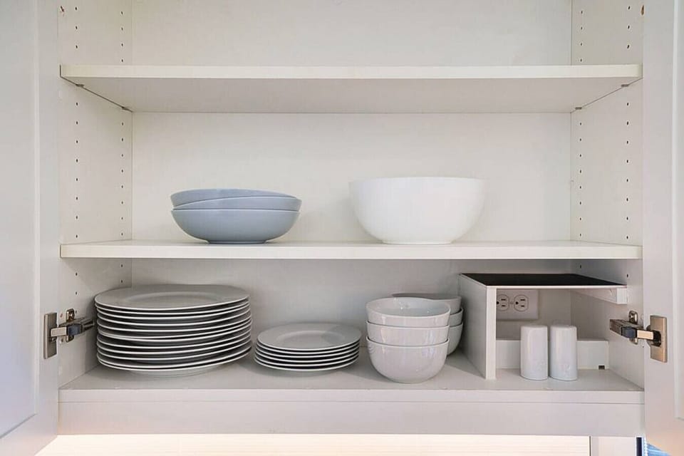 Stocked glassware, plates, bowls and platters