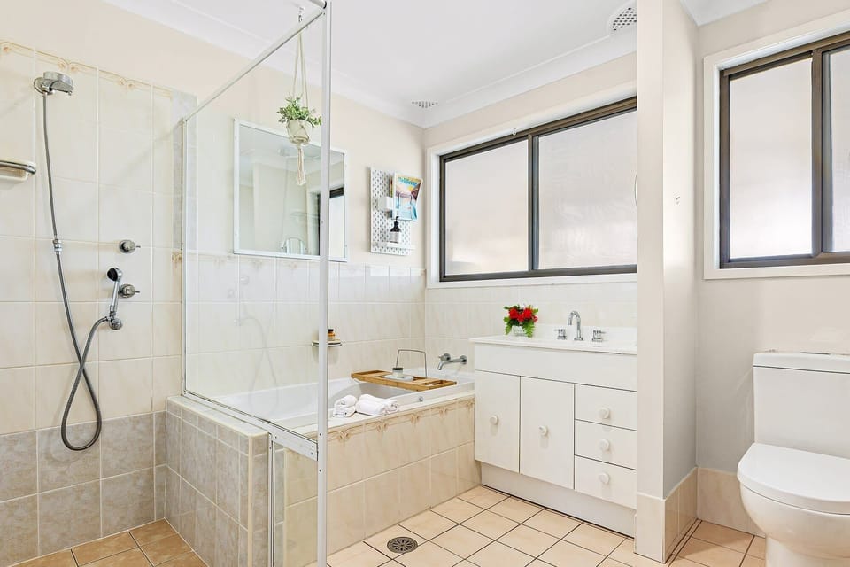 Bathroom with step free shower, bath & wc.