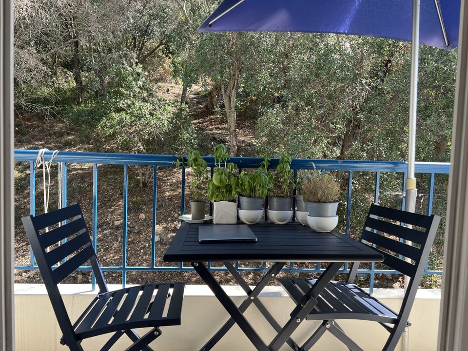 Main bedroom terrace, lovely aluminium table and chairs with forest and sea view