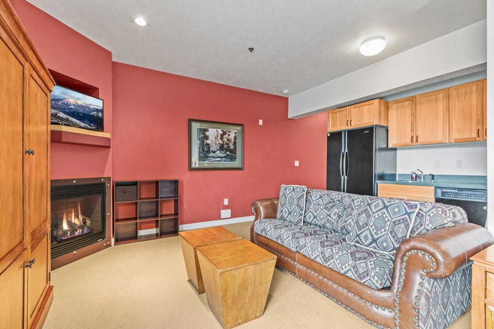 The Mason at Stillwater 3005:Cozy ambiance with a sofa set, center table, and fireplace."