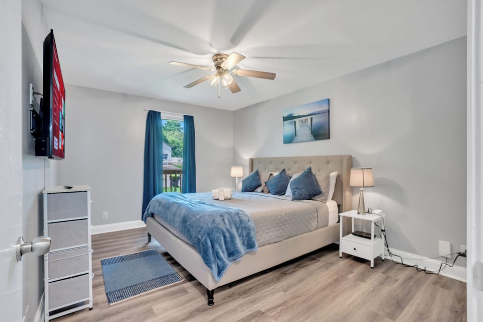 Primary Bedroom on main floor [ 55" Smart TV with King Bed]