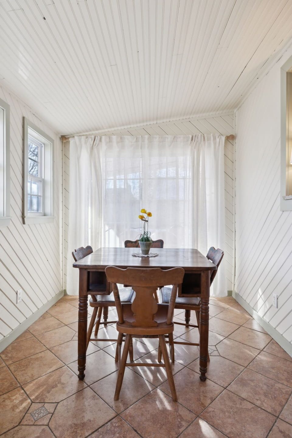 Dining Area with Sliding Doors Opening to Covered Patio
