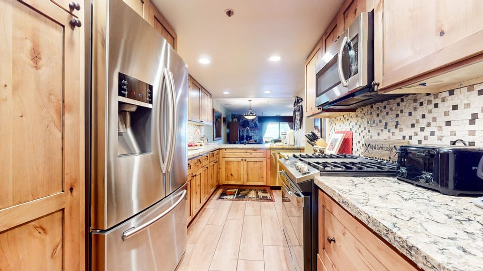 Indoors, Kitchen, Lamp, Rug, Refrigerator