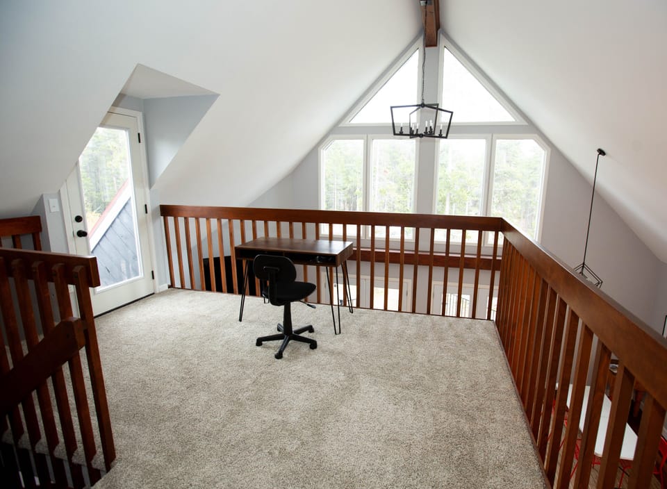 Dedicated workspace on the loft with extension cord and internet access