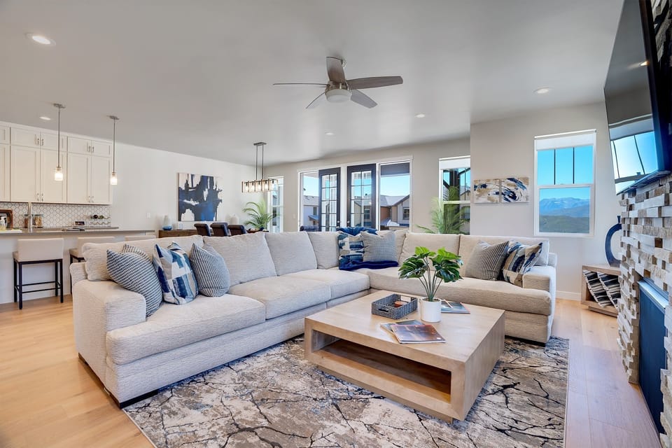 Gather and unwind in the inviting living area, equipped with a Smart TV and a cozy fireplace, setting the ambiance for memorable moments.