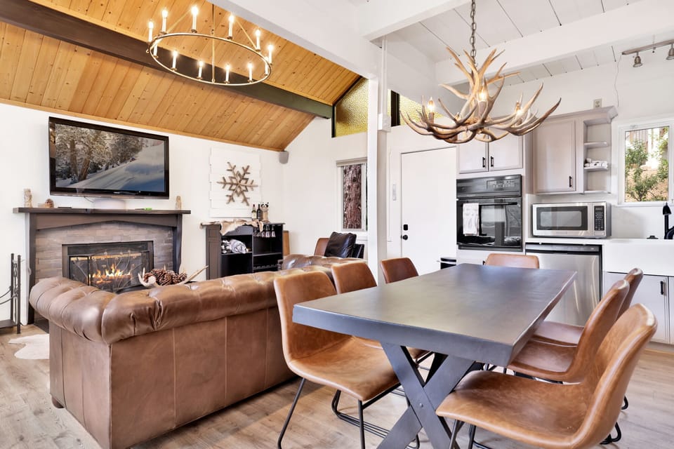 Dining area, seating for 7 and living room with cozy fireplace,