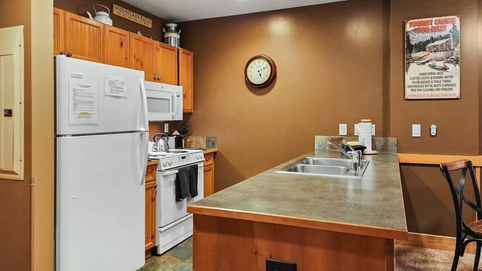 The well-laid-out kitchen includes a range of basic cookware perfect for those times you want to cook meals at home.