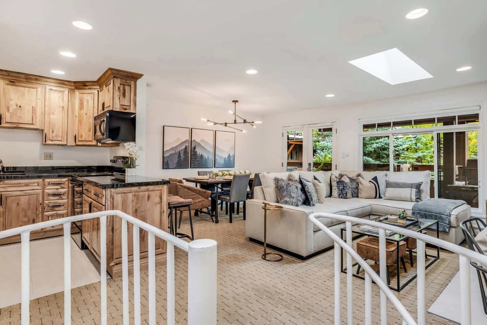 View from spiral staircase to the upstairs living area, dining room and kitchen