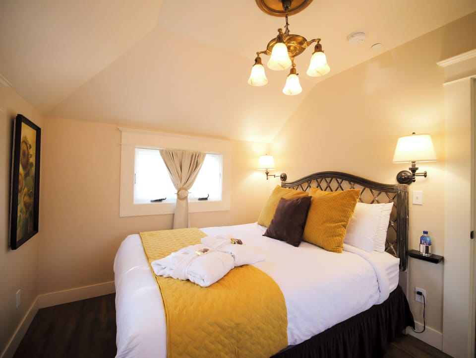 Enjoy the natural light and cheerful sunflower-themed accents in this elegant bedroom.