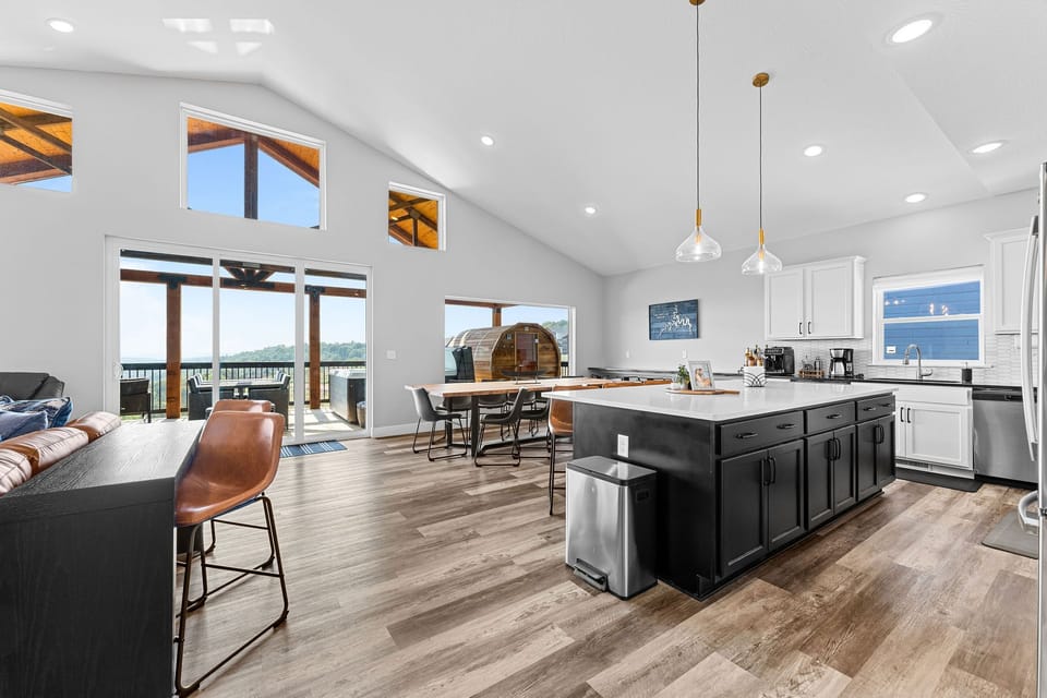 Wake up to calm lake views and prepare meals in the fully equipped kitchen within the open living space.