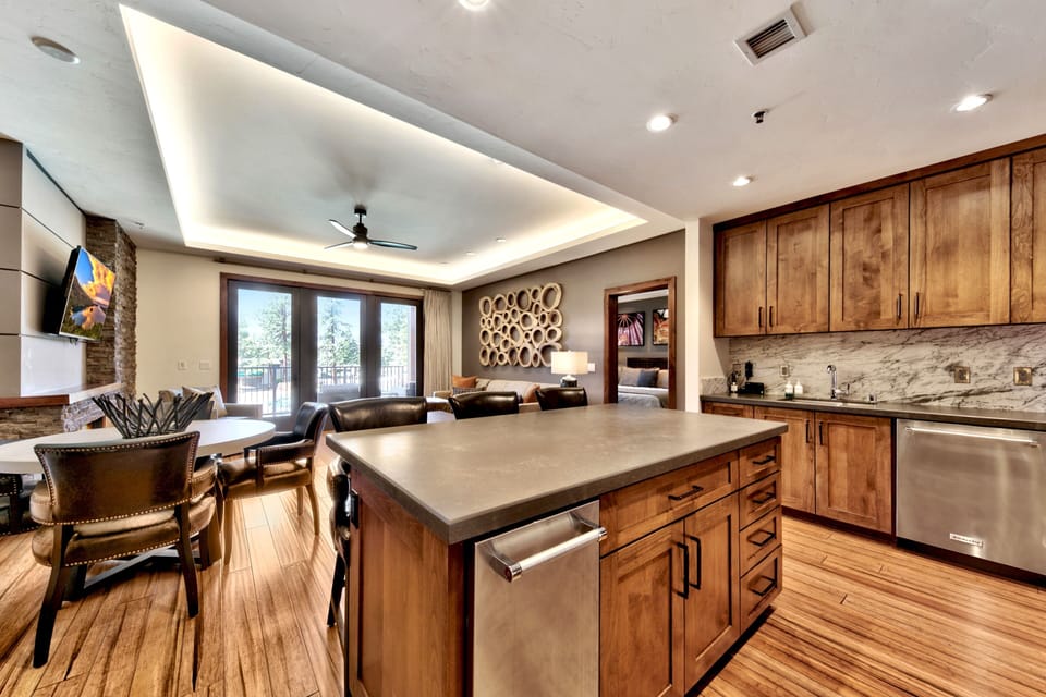 14 - Lots of room in the kitchen and beautiful marble and quartz counters throughout the condo.