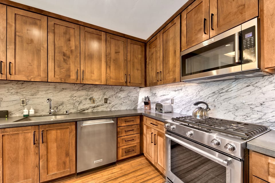 12 - Numerous small appliances - toaster, Cuisinart coffee maker, and microwave.