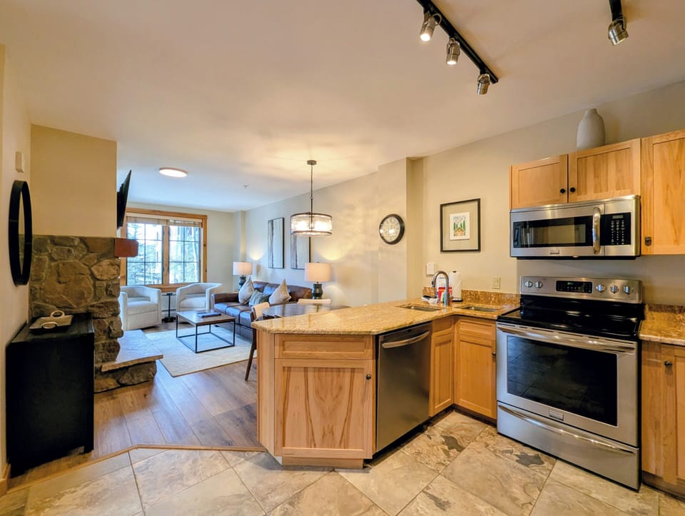 Your open-concept kitchen seamlessly flows into the cozy living area, creating the perfect space for cooking and relaxing together.