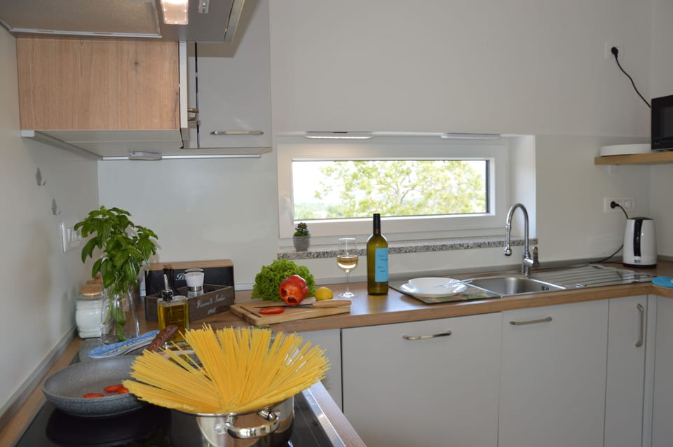Well equipped kitchen has dishwasher, microwave, fridge-freezer, oven, kettle...