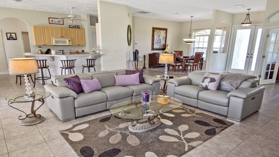 The open design combines living room, kitchen and dining room