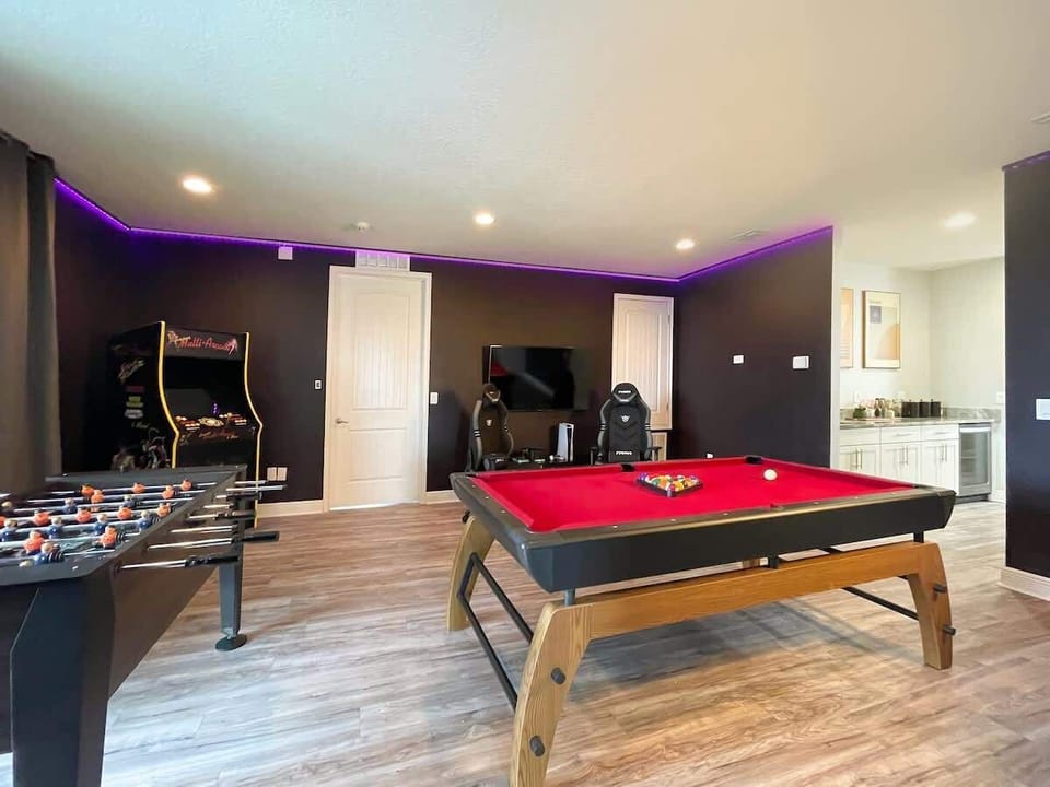 Engage in thrilling foosball matches in the game room.