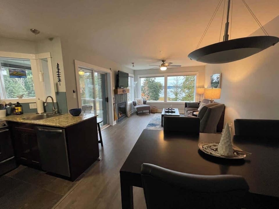 Living room with bay view and gas fireplace