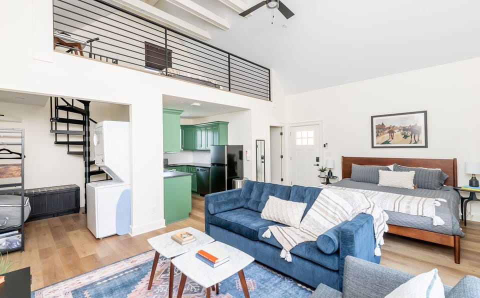 The Rickhouse loft features soaring ceiling bright modern design