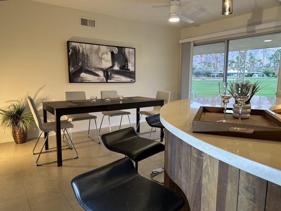 Bar and dining area. Sliding door leads to patio on golf course.