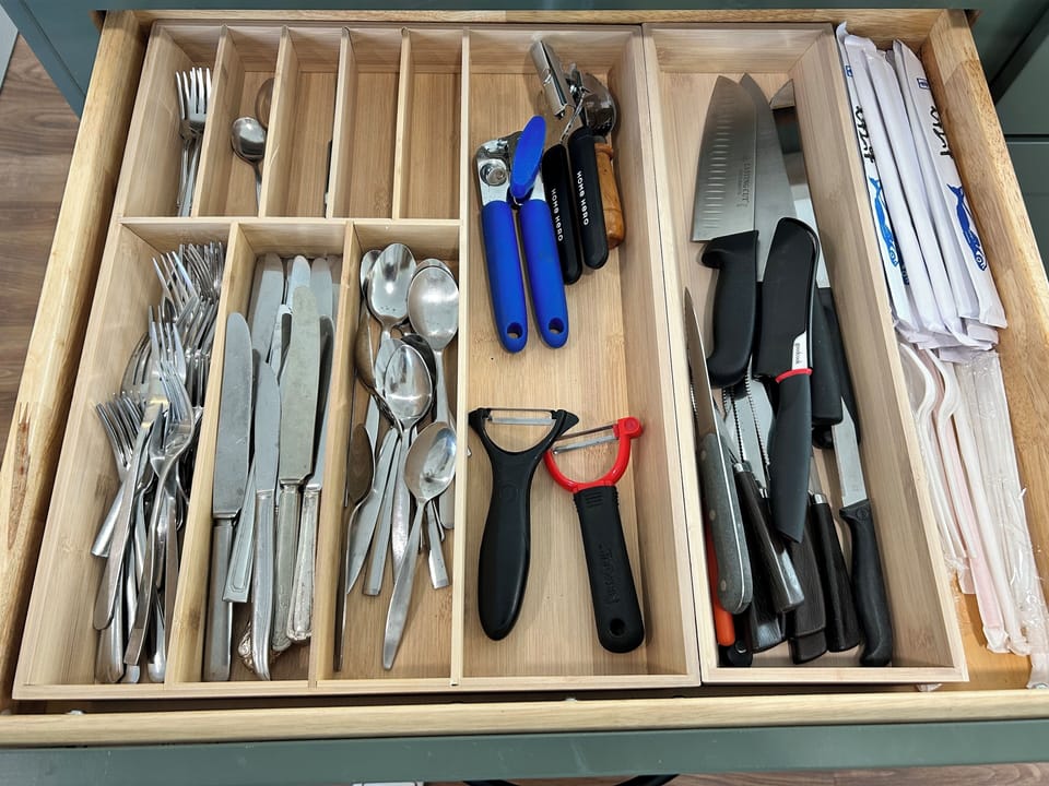 Plenty of silverware, knives, and other utensils needed for cooking.
