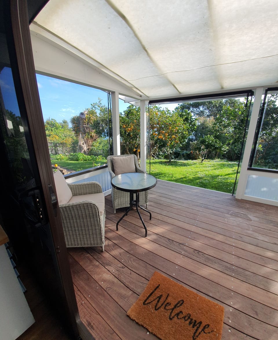 Covered Veranda overlooking a charming citrus orchard 