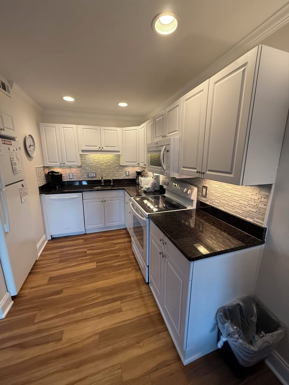 kitchen that includes stove, dishwasher, microwave and refrigerator