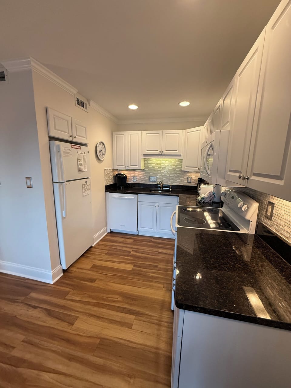 kitchen that includes stove, dishwasher, microwave and refrigerator