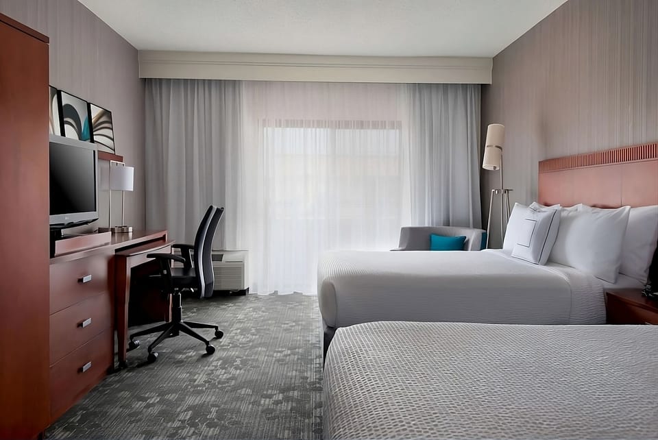 Settle in with roomy layout, desk workspace, and cozy beds.