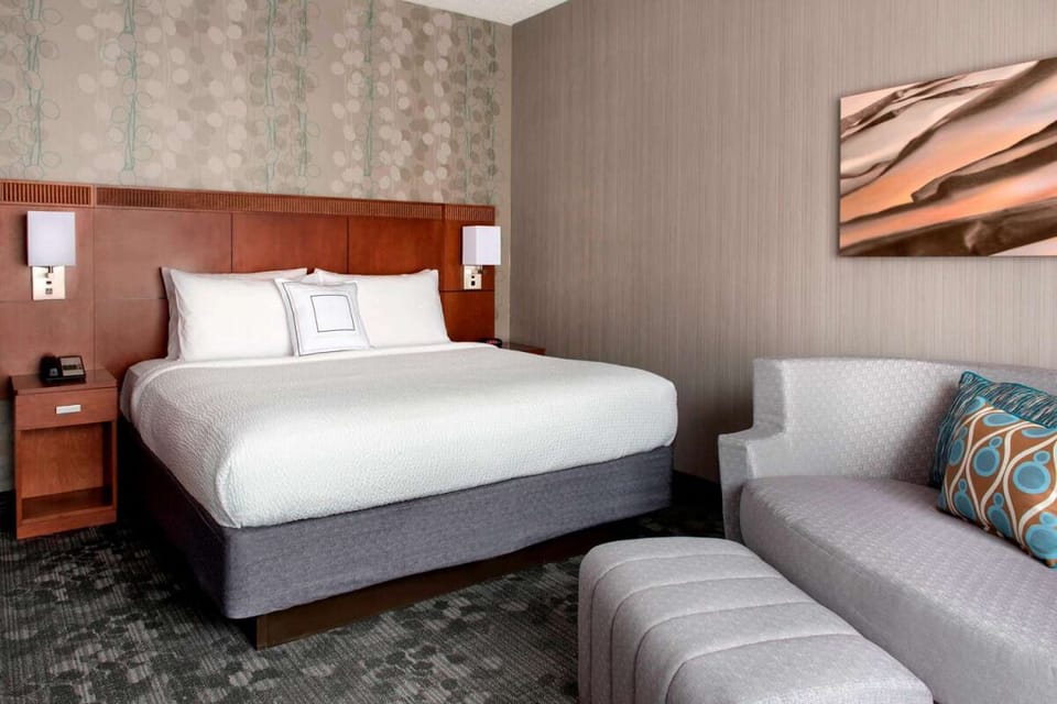 Relax into a serene retreat with sofa seating and crisp linens.
