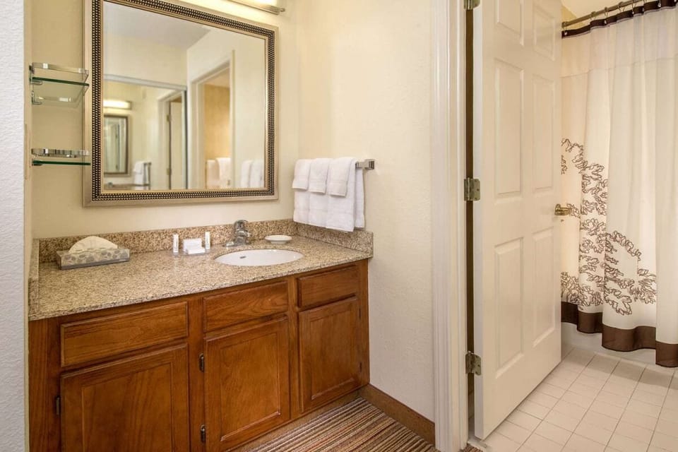 Refresh after adventures with a bright vanity and shower.