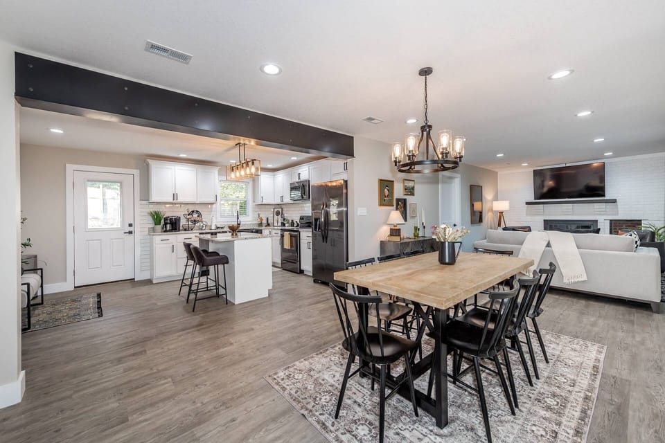 View from front entry looking into kitchen, dining area (with seating for 8) and living room