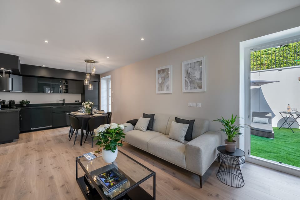 Living room open to dining area and kitchen in a cozy space