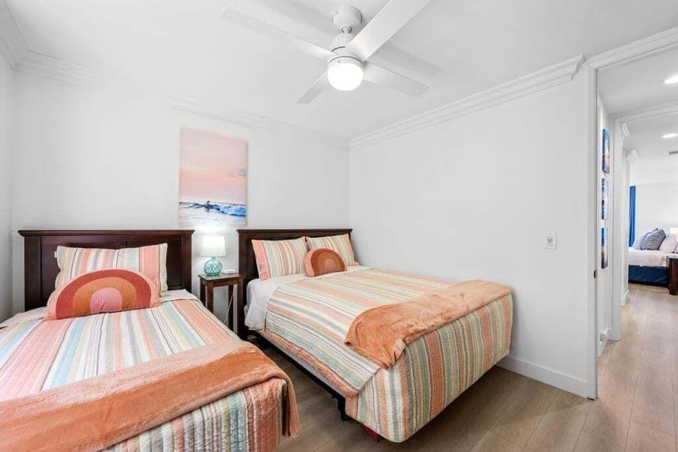 Guest bedroom has a queen bed and a twin bed