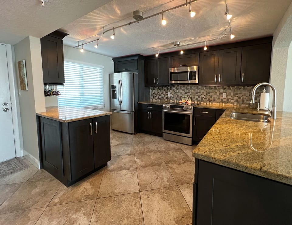 Another view of the completely renovated kitchen right off the f - Another view of the completely renovated kitchen right off the front entrance with all the necessities to make your favorite home cooked meals and snacks.
