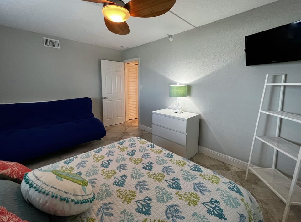 Guest bedroom with a queen sized bed, futon, and TV - Guest bedroom with a queen sized bed, futon, and TV