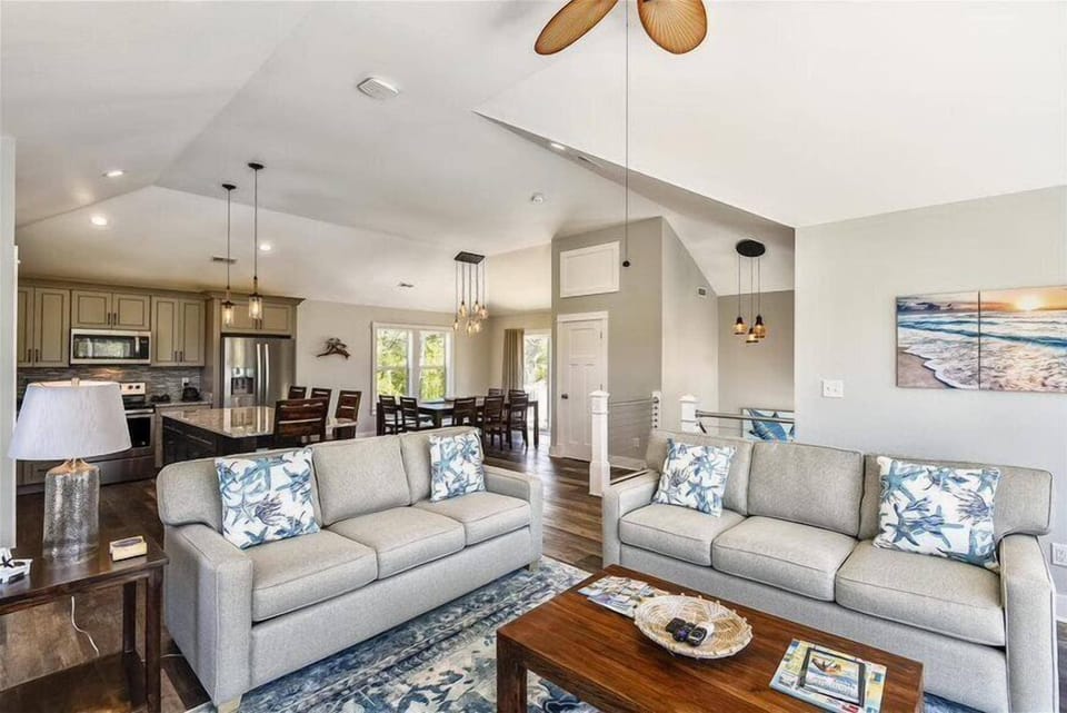 White Harmony: A Living Room and Kitchen Unite in Serene Elegance.