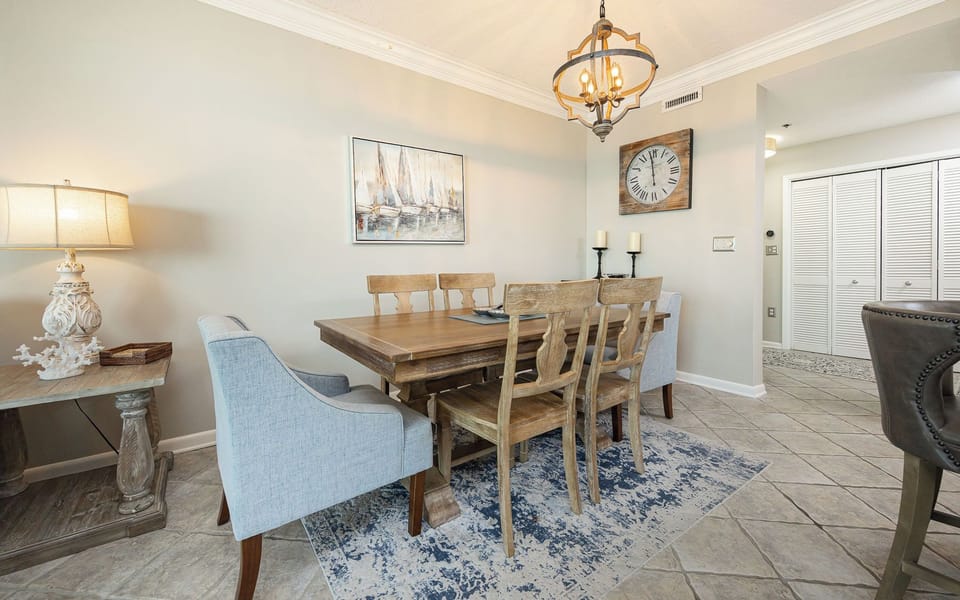 Create shared stories at the rustic dining table, surrounded by cozy decor and inviting vibes