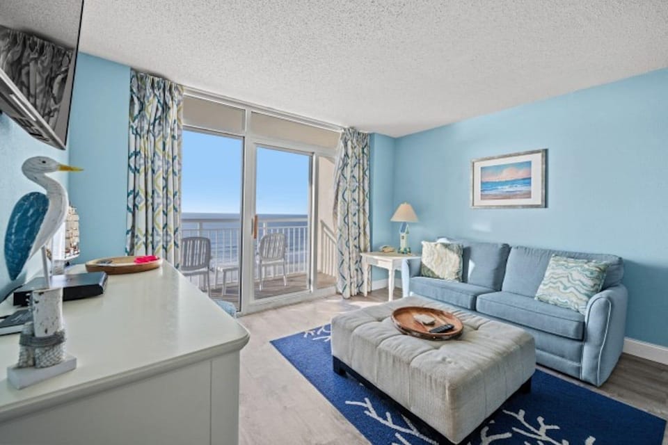 The ocean front living room is well-appointed with comfortable furnishings.