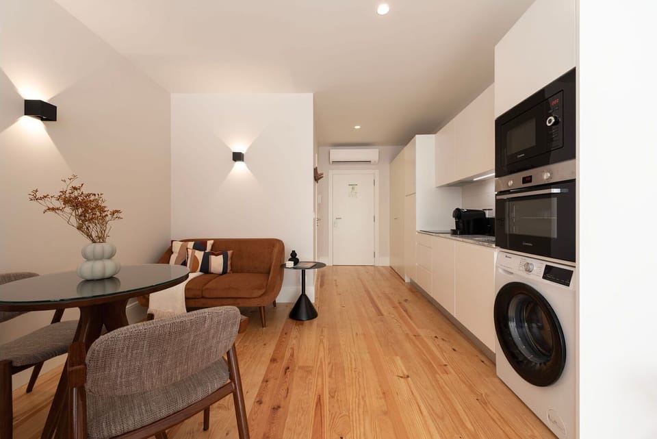 This premium apartment offers a seamless transition between the living room, dining area and kitchennette, creating a harmonious and spacious environment.